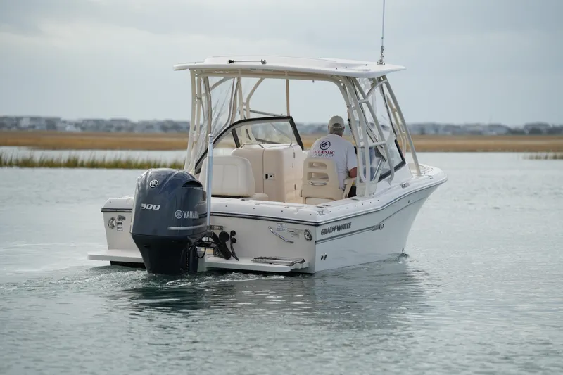 Slide: The Image of 2016 Grady-White Freedom 225 boat with Yamaha 300 engine on calm water. - 6