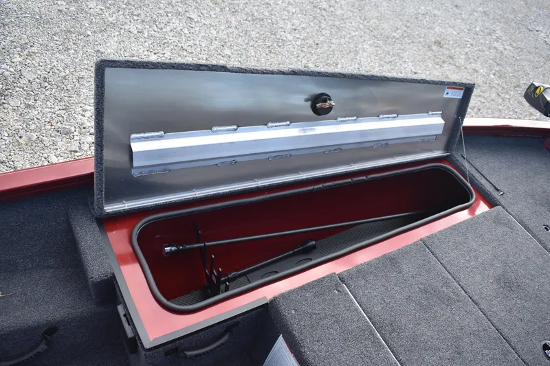 Slide: The Image of 2026 Lowe Stinger 175C boat storage compartment with open lid, showcasing interior space. - 12