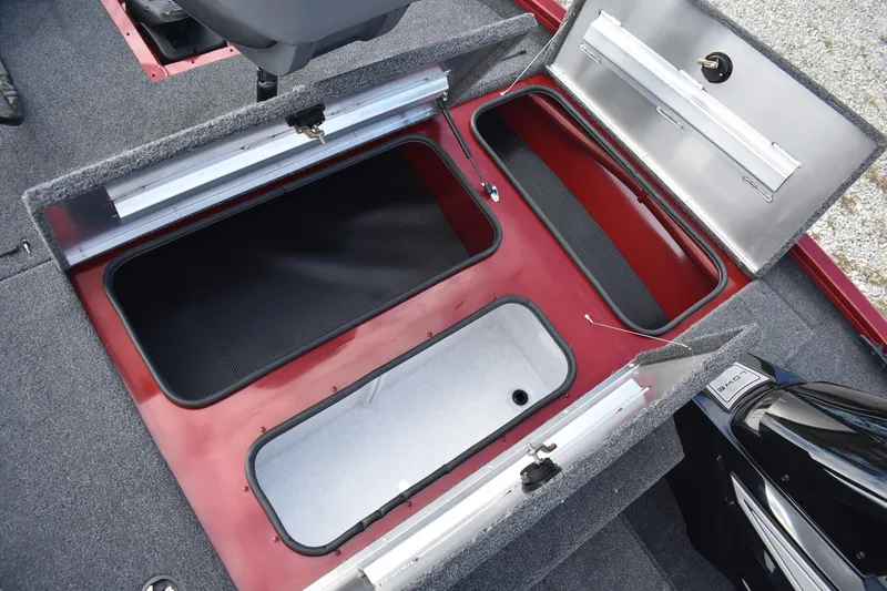 Slide: The Image of 2026 Lowe Stinger 175C boat storage compartments with open lids, showcasing interior design. - 13