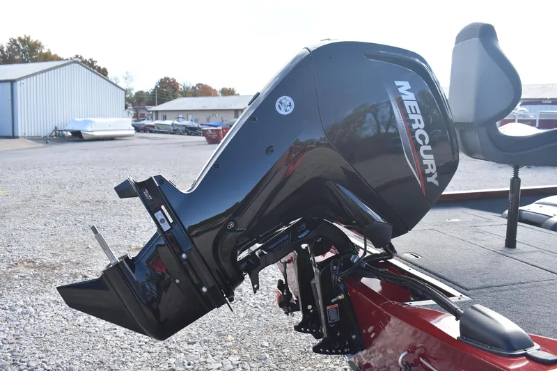 Slide: The Image of 2026 Lowe Stinger 175C boat with Mercury outboard motor in a marina setting. - 7