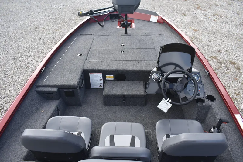 Slide: The Image of 2026 Lowe Stinger 175C boat interior with steering wheel and seating arrangement. - 8