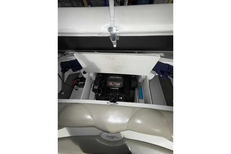 Slide: The Image of 1999 Four Winns 220 Horizon boat engine compartment with Volvo Penta engine visible. - 10