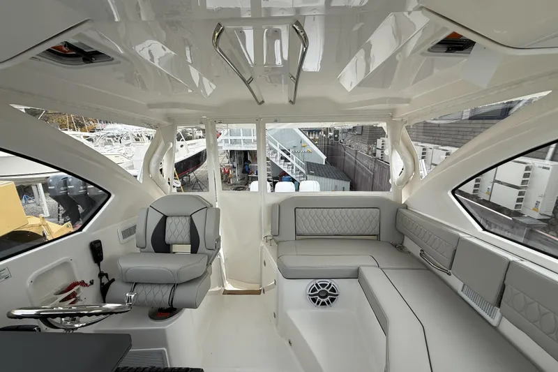 Slide: The Image of Luxurious interior of 2026 Pursuit OS 355 Offshore boat with plush seating and modern design. - 5