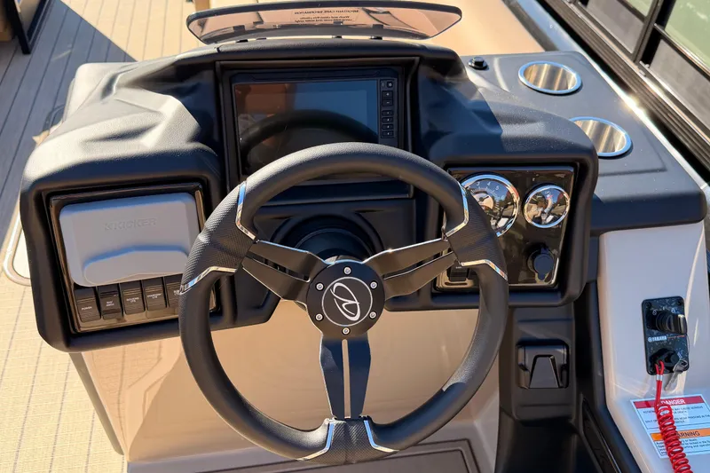 Slide: The Image of 2026 Veranda VR 265 VL Blackout Edition boat dashboard with steering wheel and controls. - 11