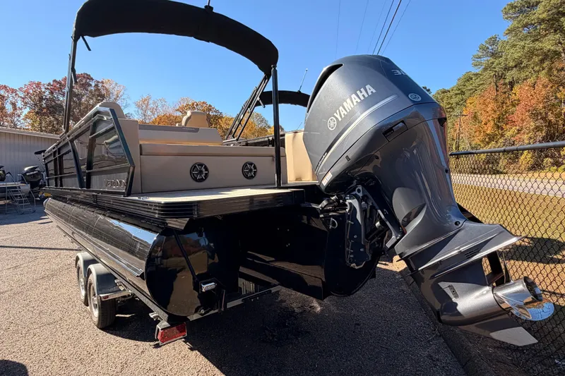 Slide: The Image of 2026 Veranda VR 265 VL Blackout Edition pontoon boat with Yamaha engine, parked outdoors. - 17