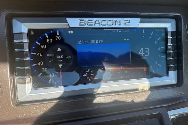 Slide: The Image of Dashboard of 2019 Premier 260 Grand Entertainer with Beacon 2 display showing speed and temperature. - 25