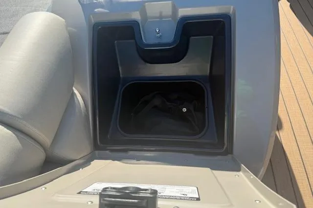 Slide: The Image of Storage compartment in 2019 Premier 260 Grand Entertainer boat, open with visible interior. - 26