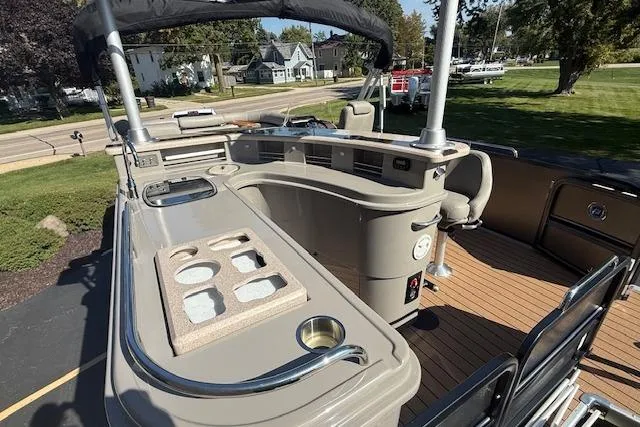 Slide: The Image of 2019 Premier 260 Grand Entertainer pontoon boat with luxurious bar and seating area. - 5