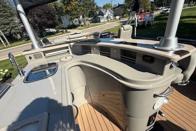 Slide: The Image of 2019 Premier 260 Grand Entertainer boat with sleek bar area and modern amenities. - 7