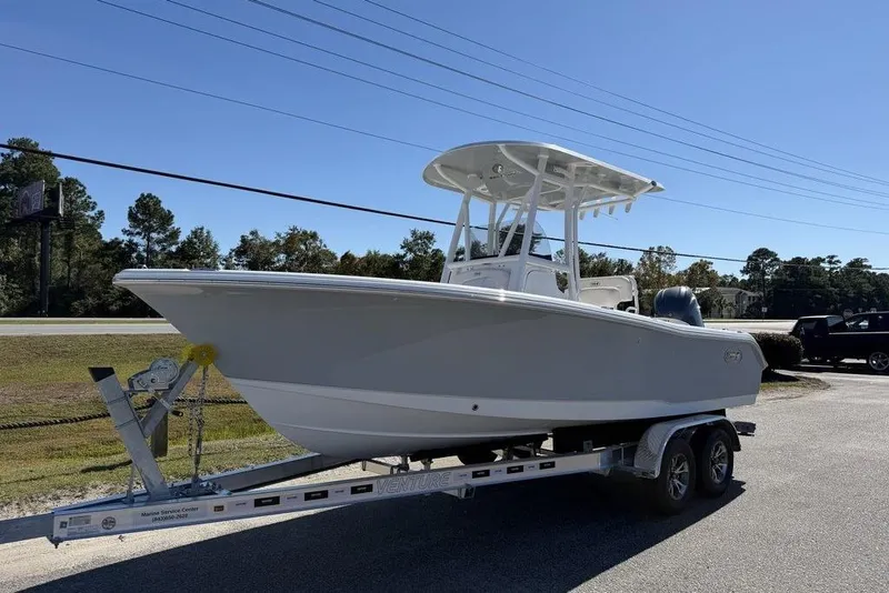 The Image of 2026 Sea Hunt Ultra 235 SE boat on trailer, side view, outdoors. - 1
