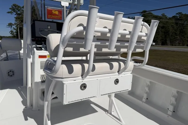 Slide: The Image of 2026 Sea Hunt Ultra 235 SE boat interior with seating and steering wheel. - 12