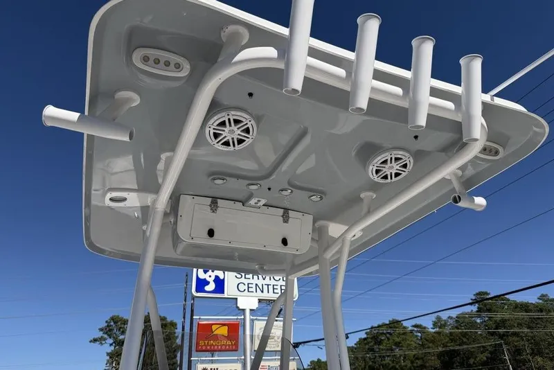 Slide: The Image of 2026 Sea Hunt Ultra 235 SE boat console with Garmin display and steering wheel. - 14