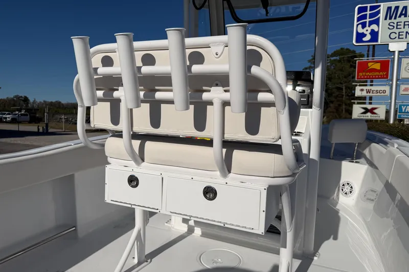 Slide: The Image of 2026 Sea Hunt Ultra 235 SE boat interior with rod holders and storage compartments. - 16