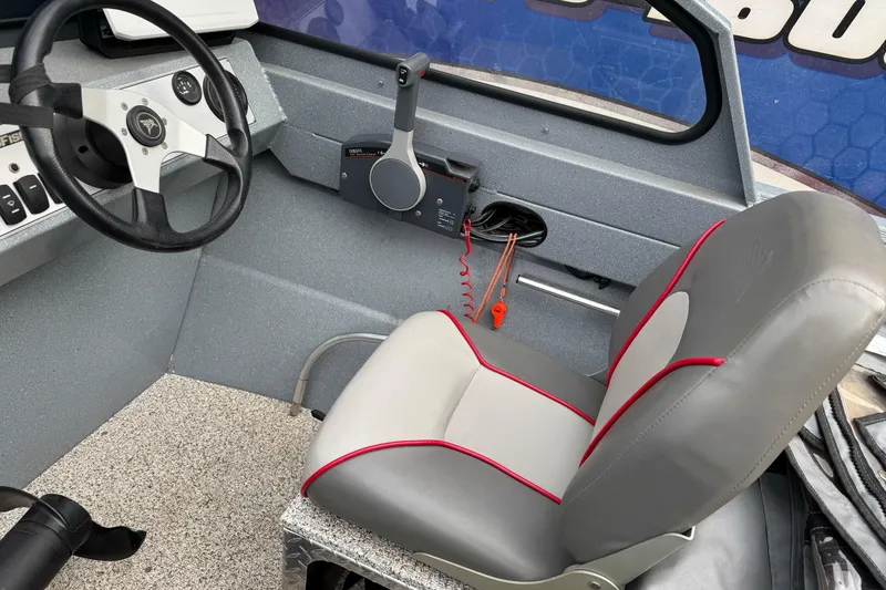 Slide: The Image of Interior of 2014 KingFisher 1625 Falcon XL boat with steering wheel and seat. - 10