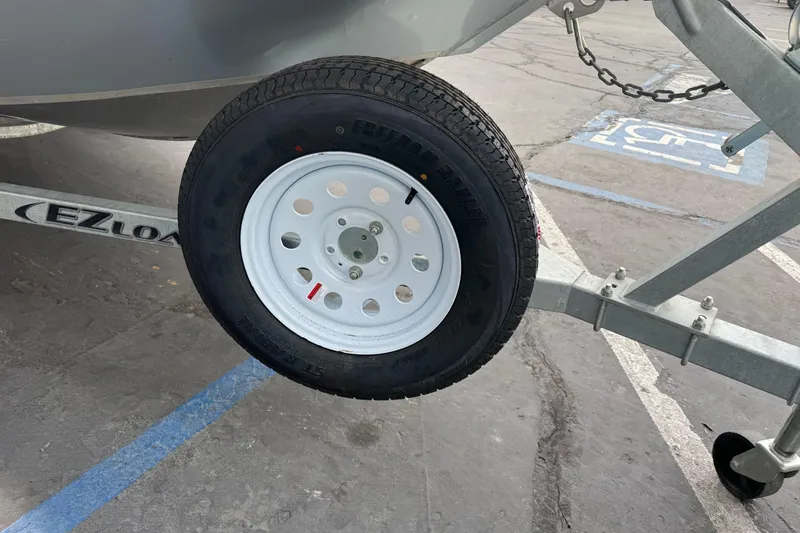 Slide: The Image of Trailer wheel of 2014 KingFisher 1625 Falcon XL boat on EZ Loader trailer. - 5