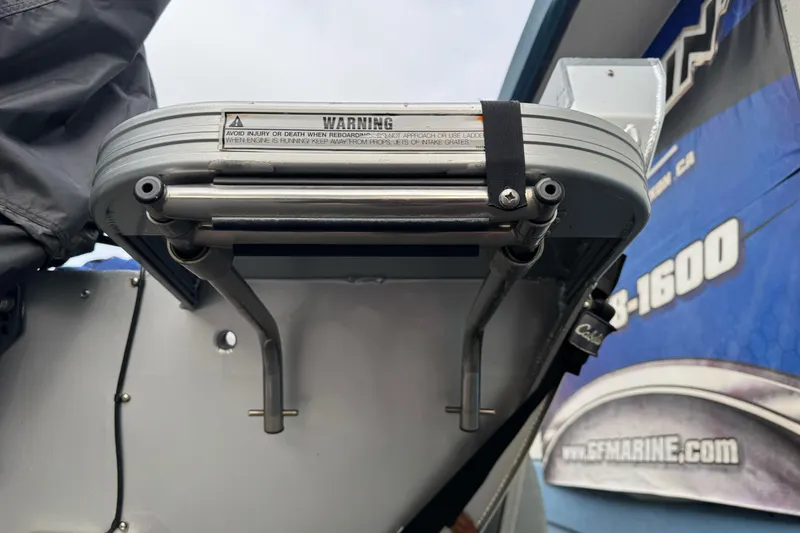 Slide: The Image of 2014 KingFisher 1625 Falcon XL boat ladder with safety warning label. - 6