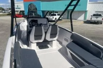 Slide: The Image of 2022 Axopar 22 TT boat interior with dual seats and modern dashboard. - 6