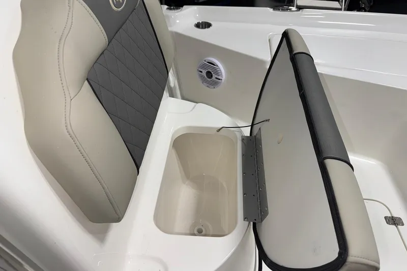 Slide: The Image of Key West 230 Bay Reef 2026 boat seat with storage compartment open. - 10