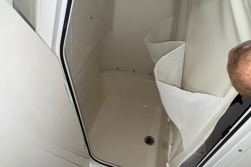 Slide: The Image of Interior view of 2026 Key West 230 Bay Reef boat compartment with drain. - 20