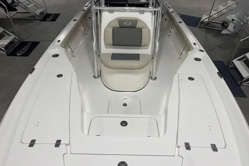 Slide: The Image of 2026 Key West 230 Bay Reef boat interior with seating and storage compartments. - 5