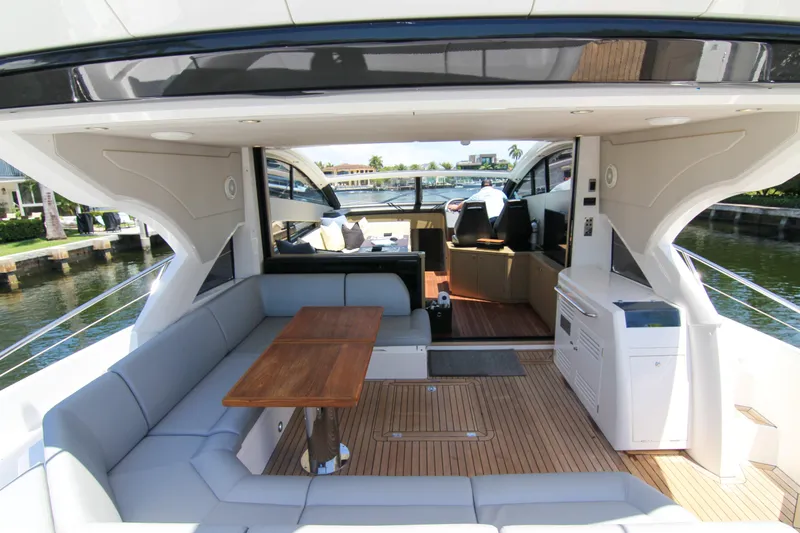 Slide: The Image of Luxurious 2017 Sunseeker Predator 57 yacht interior with elegant seating and wooden table. - 26