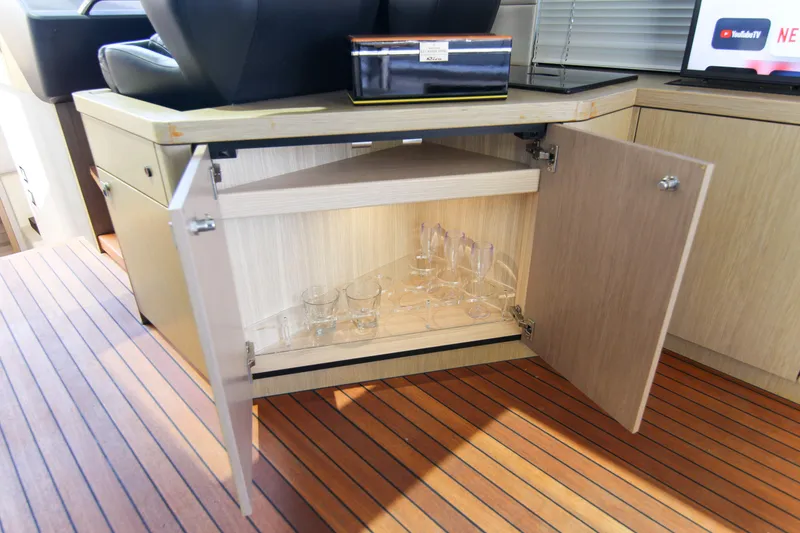Slide: The Image of Open cabinet with glassware on Sunseeker Predator 57 yacht, 2017 model. - 27