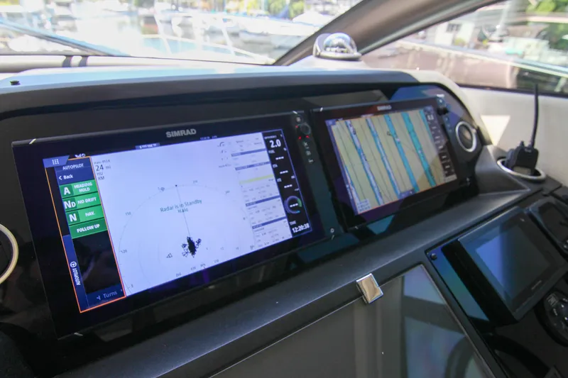 Slide: The Image of Control panel of a 2017 Sunseeker Predator 57 yacht with navigation displays. - 31