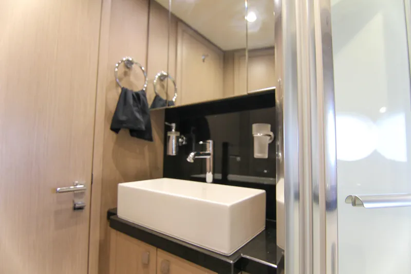 Slide: The Image of Luxurious bathroom interior of 2017 Sunseeker Predator 57 yacht, featuring modern sink and fixtures. - 37