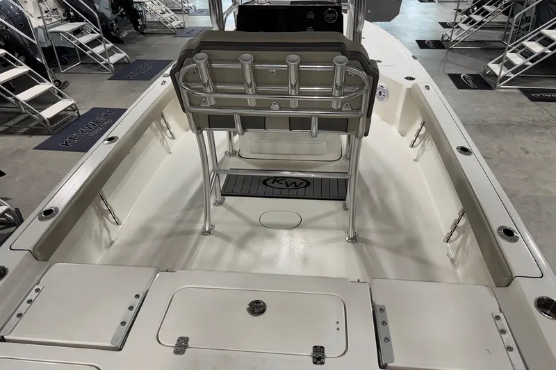 Slide: The Image of 2026 Key West 230 Bay Reef boat interior with seating and rod holders. - 4