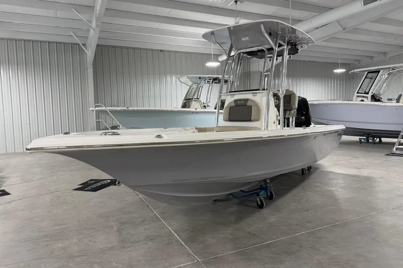 The Image of 2026 Key West 230 Bay Reef boat in showroom, sleek design, modern features. - 1