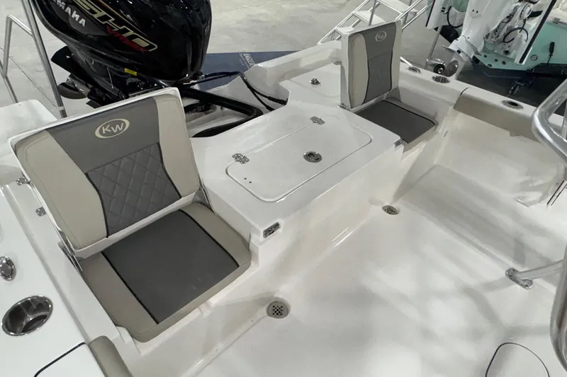 Slide: The Image of 2026 Key West 230 Bay Reef boat interior with seating and Yamaha engine. - 14