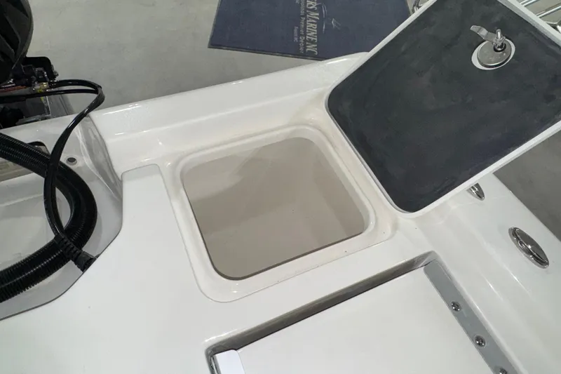 Slide: The Image of Open storage compartment on 2026 Key West 230 Bay Reef boat deck. - 16
