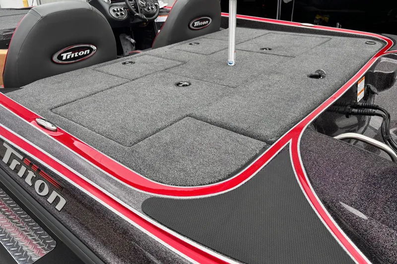 Slide: The Image of 2026 Triton 19 TrX Patriot boat interior with sleek design and comfortable seating. - 13