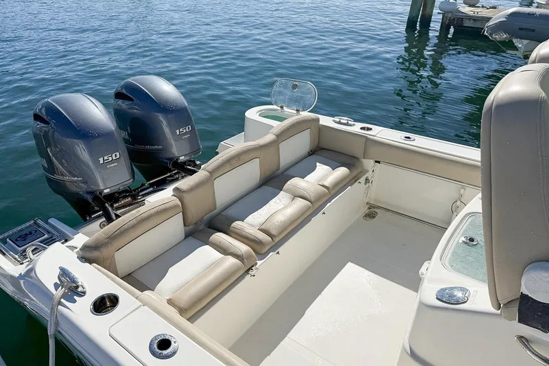 Slide: The Image of 2017 NauticStar 2602 Legacy boat with twin Yamaha 150 engines on calm water. - 7