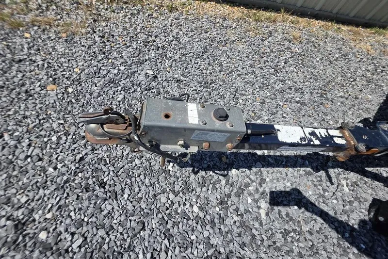 Slide: The Image of Trailer hitch of a 2008 Nitro 482 DC on gravel surface. - 15