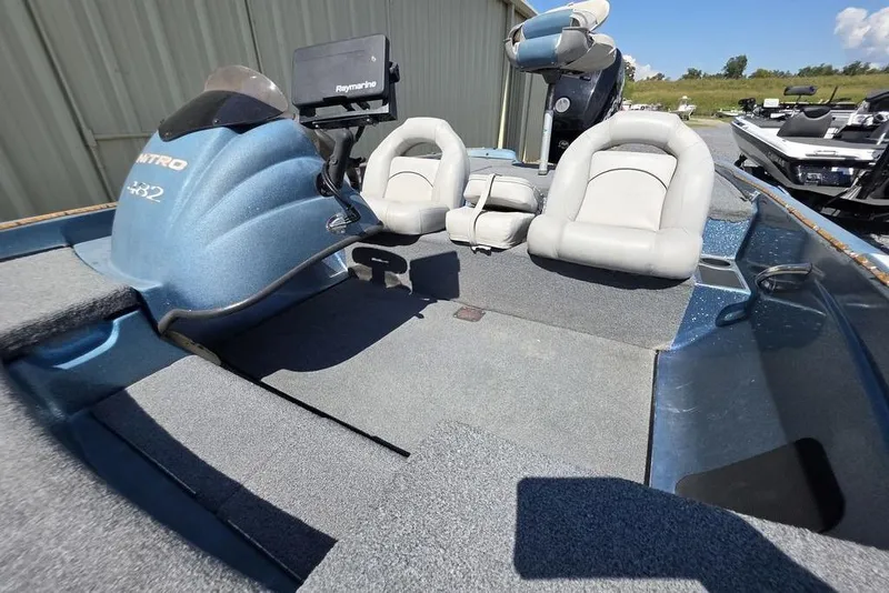 Slide: The Image of 2008 Nitro 482 DC boat interior with seating and Raymarine equipment. - 16