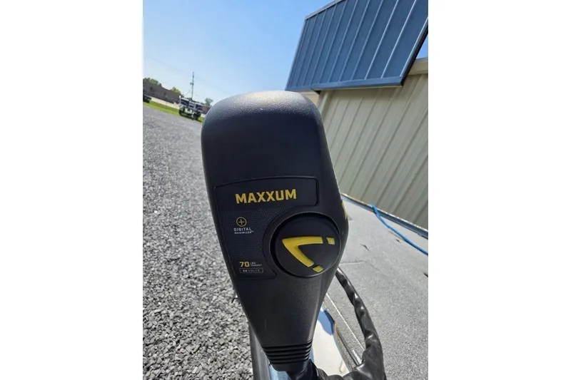 Slide: The Image of Maxxum motor on 2008 Nitro 482 DC boat, outdoor setting, sunny day. - 17