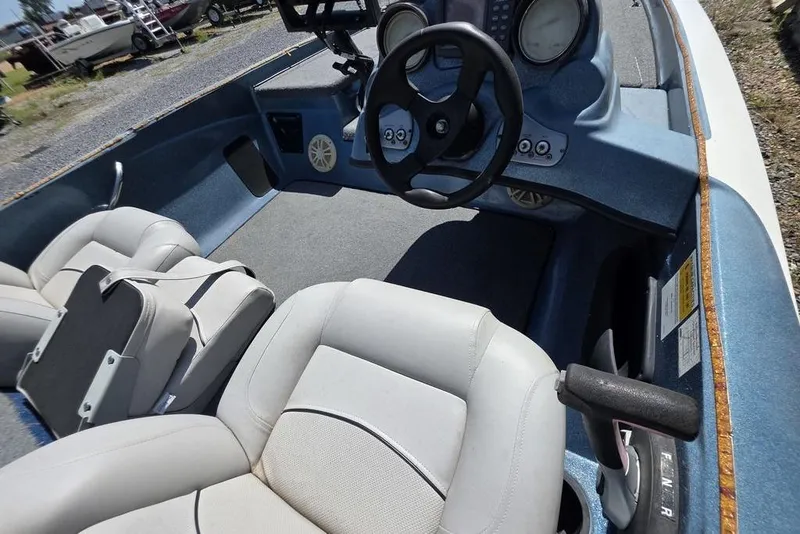 Slide: The Image of Interior of a 2008 Nitro 482 DC boat with steering wheel and seating. - 6