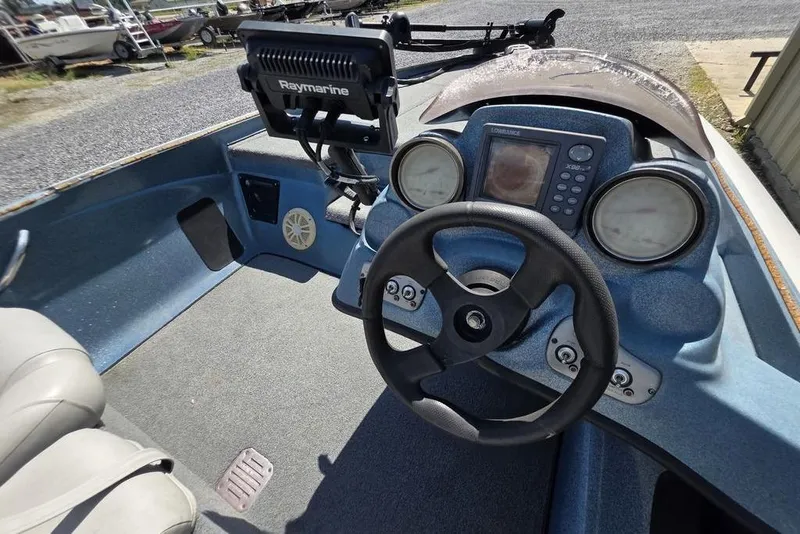 Slide: The Image of 2008 Nitro 482 DC boat dashboard with steering wheel and Raymarine electronics. - 7