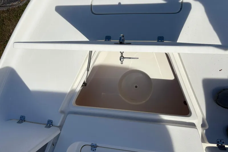 Slide: The Image of Open storage compartment on 2026 Key West 230 Bay Reef boat. - 11