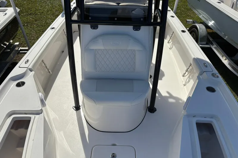 Slide: The Image of 2026 Key West 230 Bay Reef boat interior with seating and storage compartments. - 13