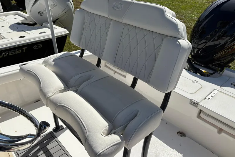 Slide: The Image of 2026 Key West 230 Bay Reef boat with cushioned seating and Yamaha engine. - 8