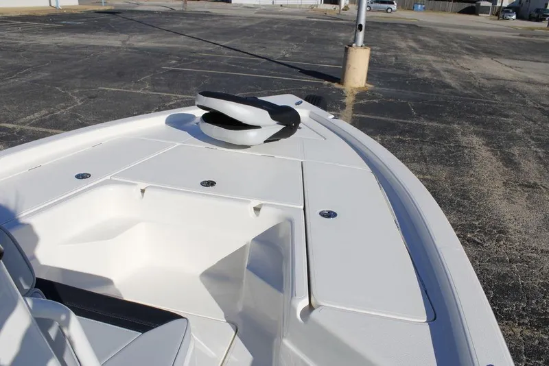 Slide: The Image of 2026 Skeeter SX221 boat deck with storage compartments in a parking lot. - 14