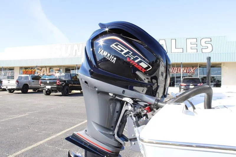 Slide: The Image of 2026 Skeeter SX221 boat with Yamaha VMAX engine at dealership. - 22