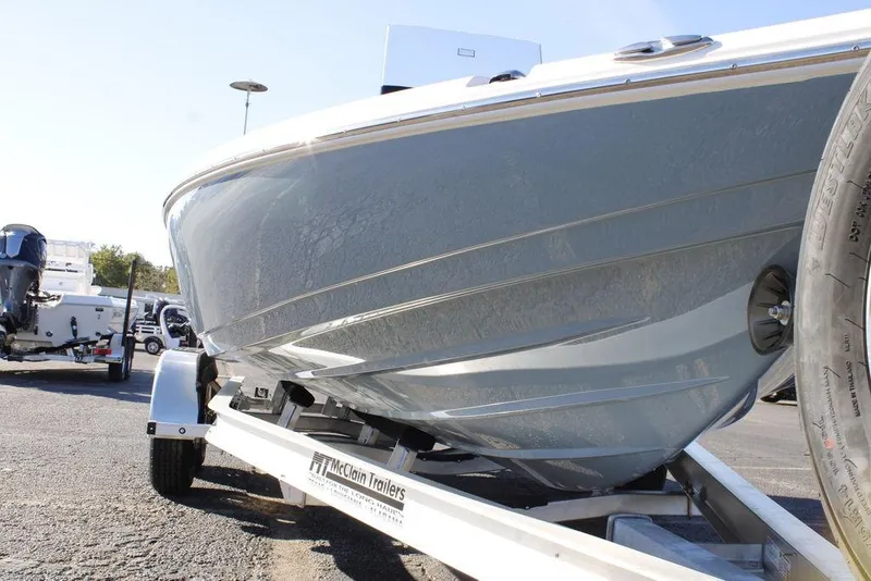 Slide: The Image of 2026 Skeeter SX221 boat on trailer, close-up view of hull and wheel. - 5