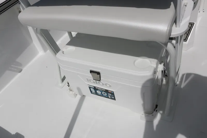 Slide: The Image of 2026 Wellcraft 202 Fisherman boat interior with Igloo cooler under seat. - 23