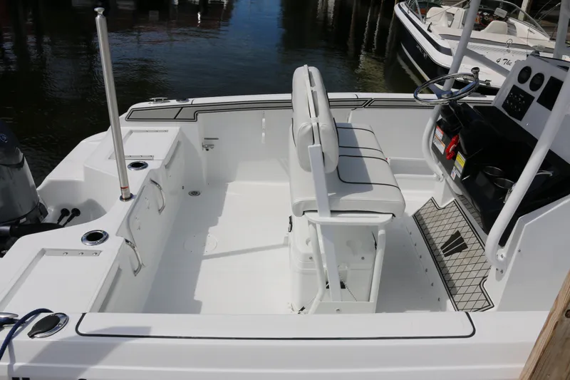 Slide: The Image of 2026 Wellcraft 202 Fisherman boat interior with seating and steering console. - 28