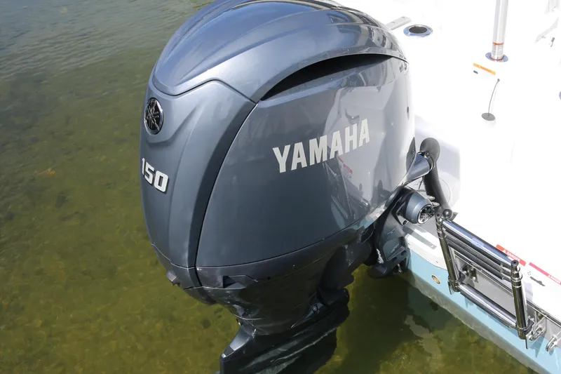 Slide: The Image of Yamaha 150 outboard motor on 2026 Wellcraft 202 Fisherman boat in shallow water. - 31