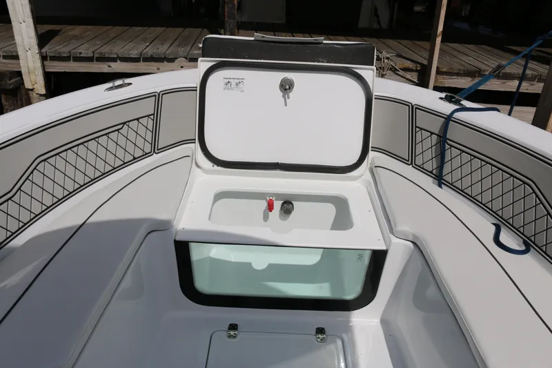 Slide: The Image of 2026 Wellcraft 202 Fisherman boat interior with storage compartment and seating. - 6