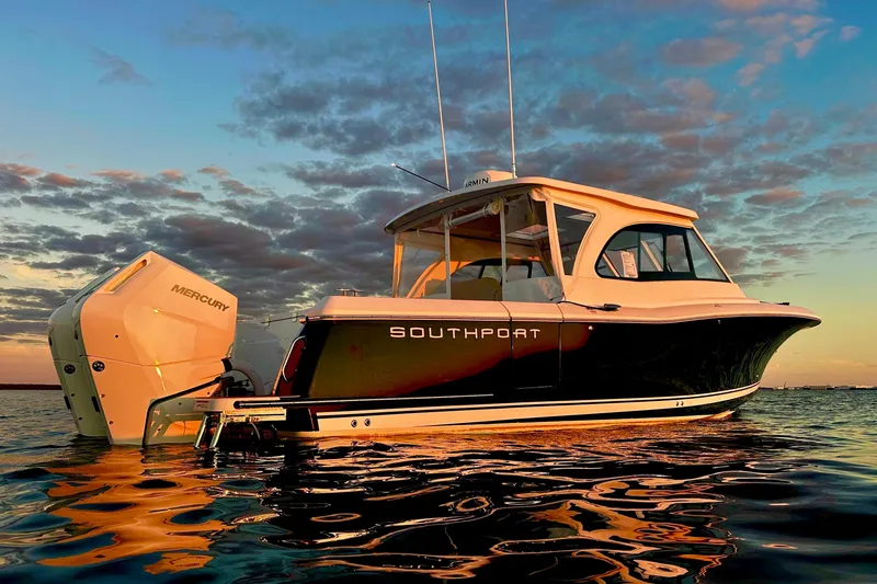 The Image of 2025 Southport 33 DC boat docked in a marina, clear sky background. - 0